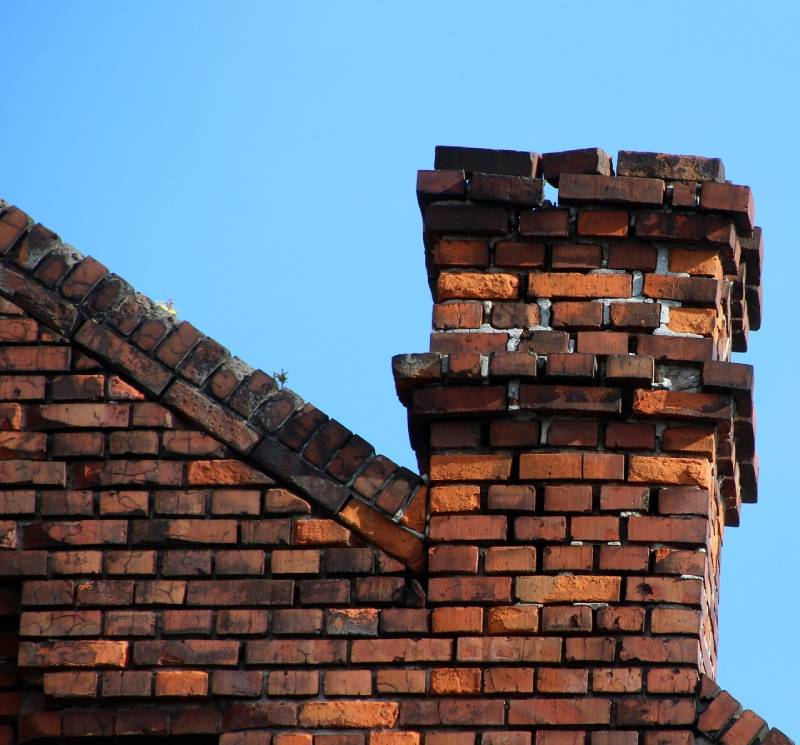 Signs Your Brooklyn Park Home Needs a Chimney Inspection Damaged chimney on an Brooklyn Park home showing cracks and missing mortar